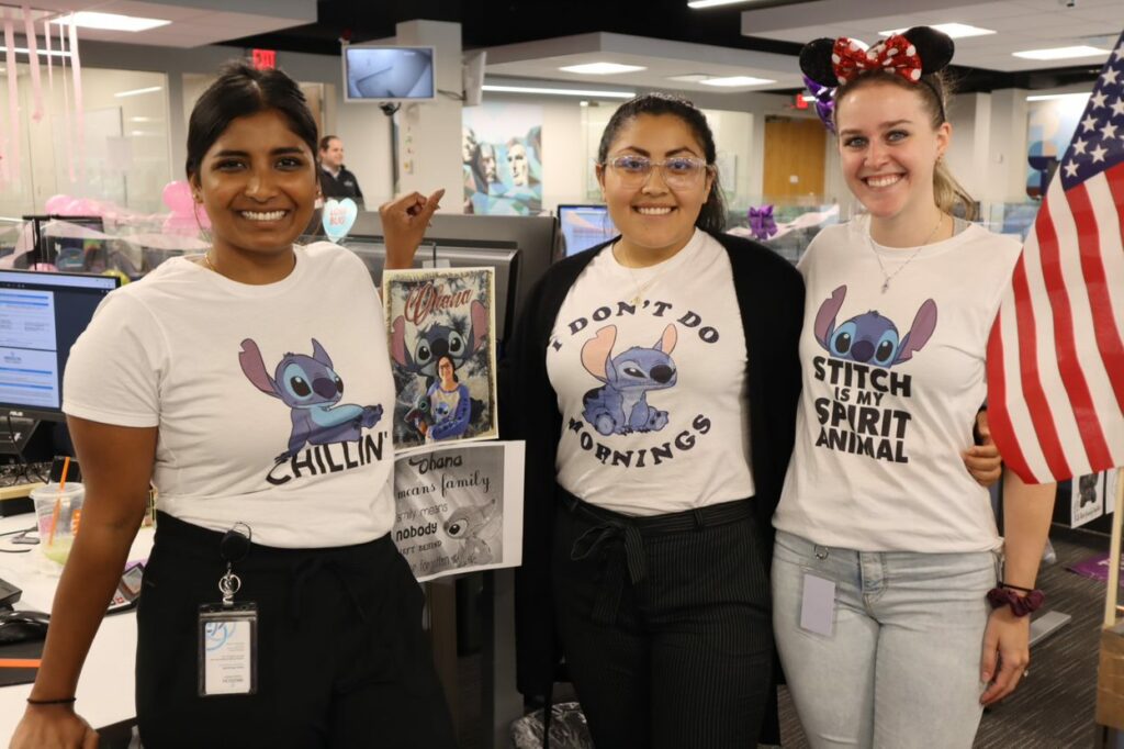 Madison Trust employees dressed up as Disney characters Stitch to celebrate Madison Trust, Broad Financial, and Disney Day during Sprit Week.