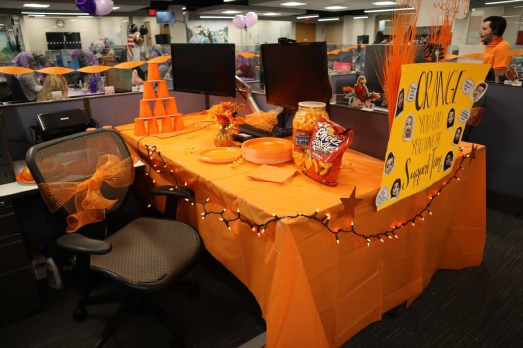 Desk decorated in orange for Color Day during Spirit Week.