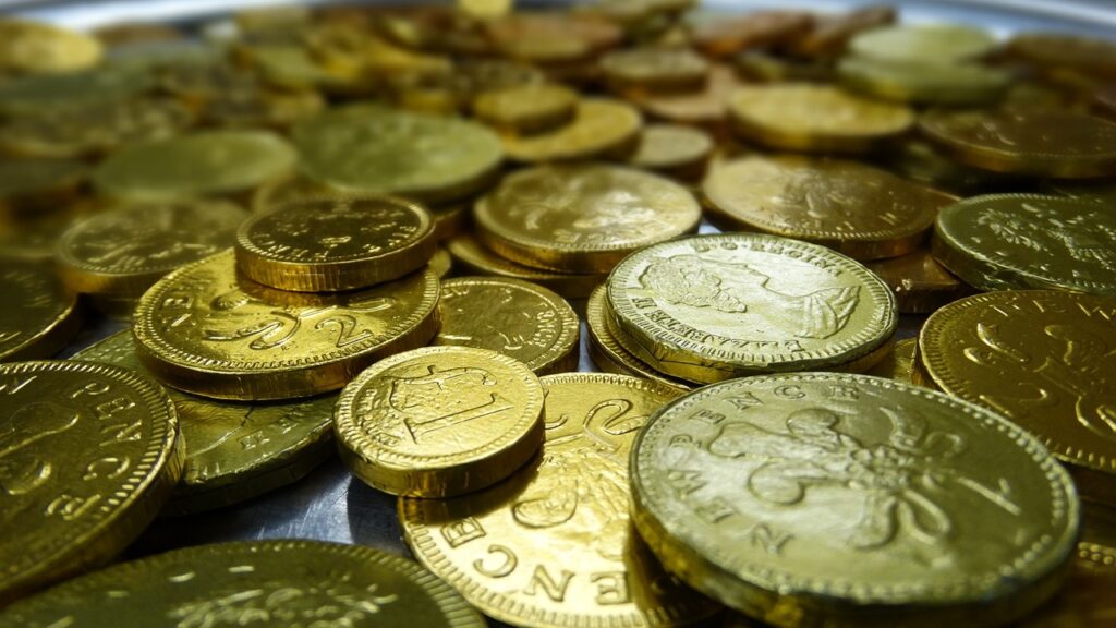 Gold coins spread out on a flat surface