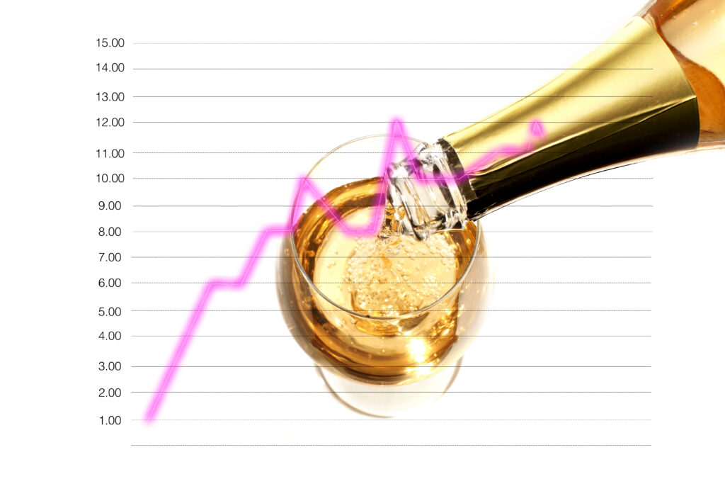A bottle of white wine being poured into a glass over a line diagram showing growth