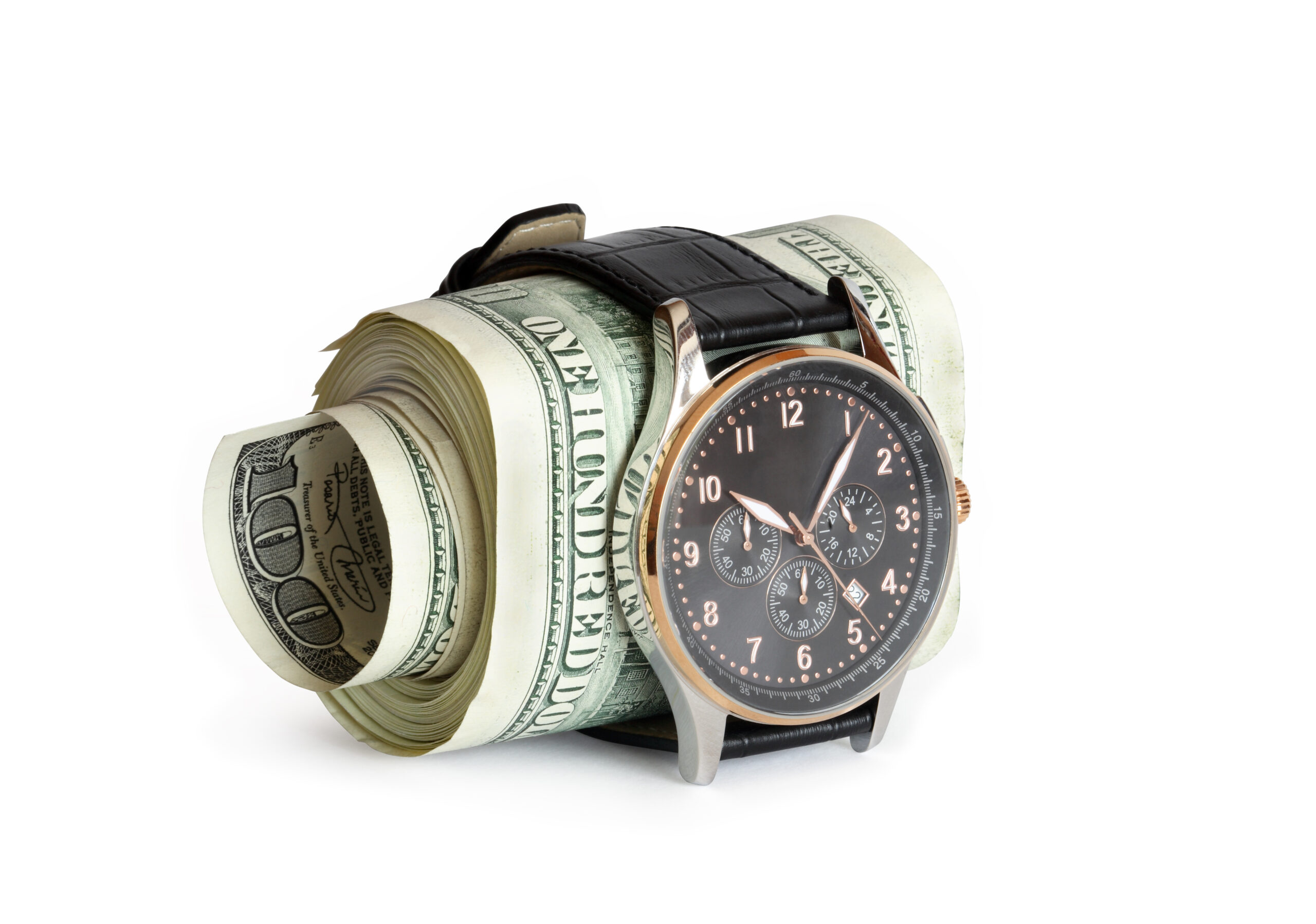 Men's wristwatch wrapped around a roll of one hundred dollar bills