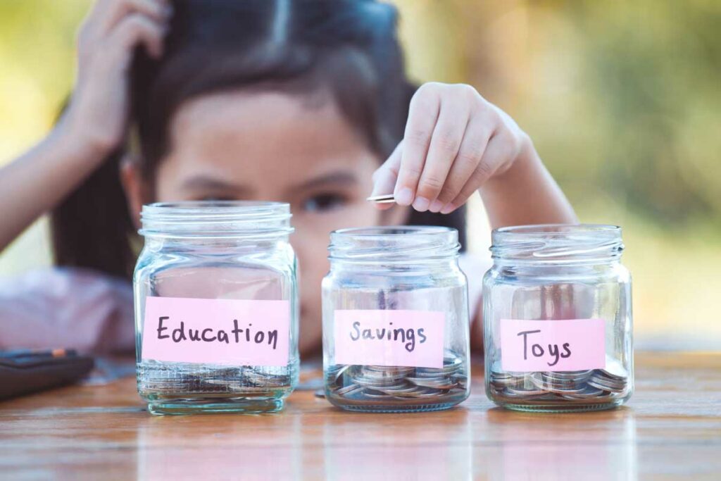 Child in front of three jars “education,” “savings,” and “toys” filled with coins, deciding to save vs. spend her money.