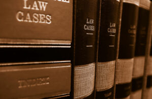 Books on shelf labeled "law cases"