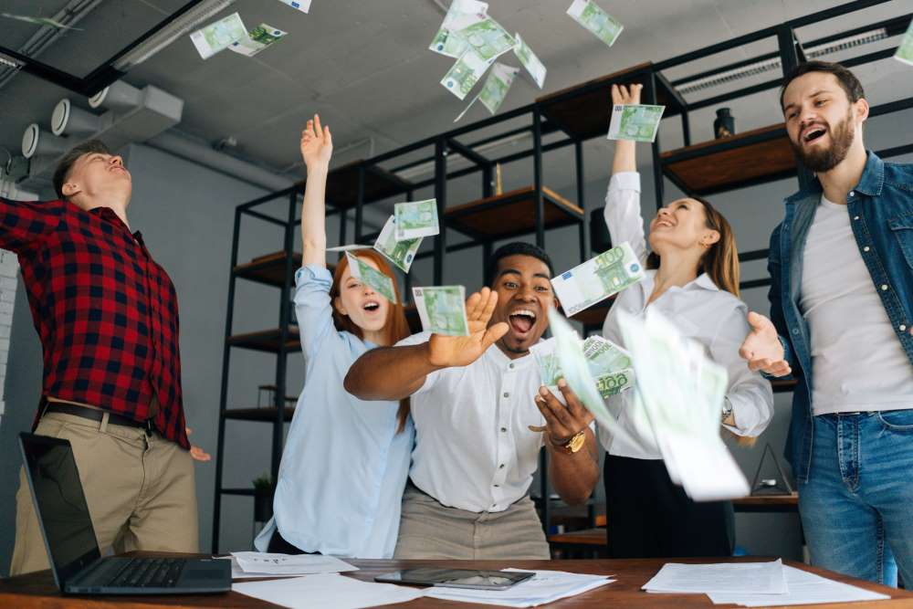 A group of investors jump for joy as they swim in the supplemental income they earned through real estate investments. 