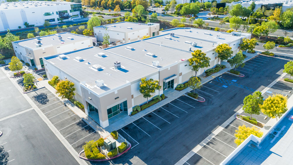 Aerial view of an industrial real estate property, which can be a residential, commercial, or industrial property and invested in with your Self-Directed IRA.