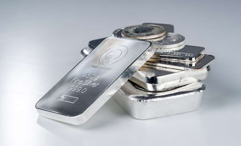 Stacked silver bullion coins and bars, providing an example of the possible investment options for silver in a Gold IRA.