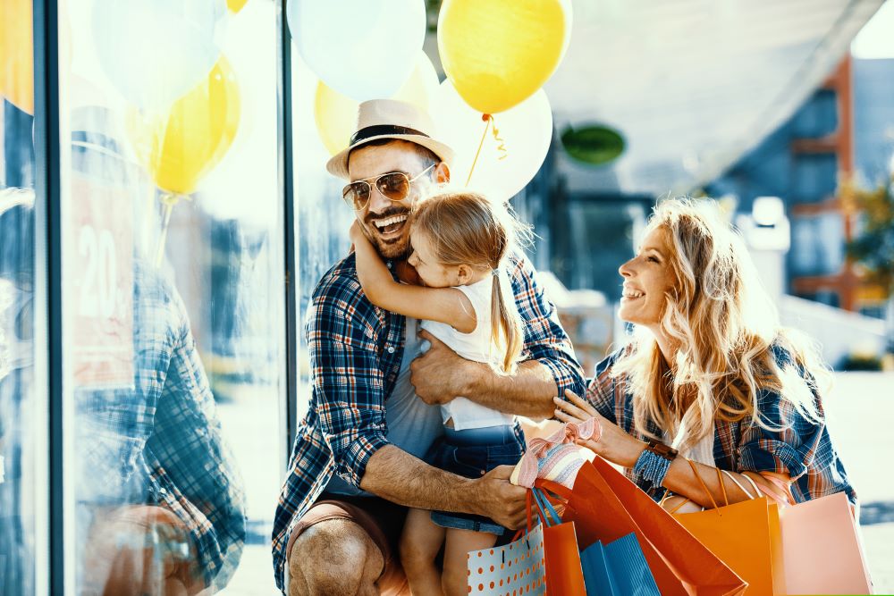A family joyfully shops as they feel at ease knowing the future of their family is more secure through their Self-Directed IRA.