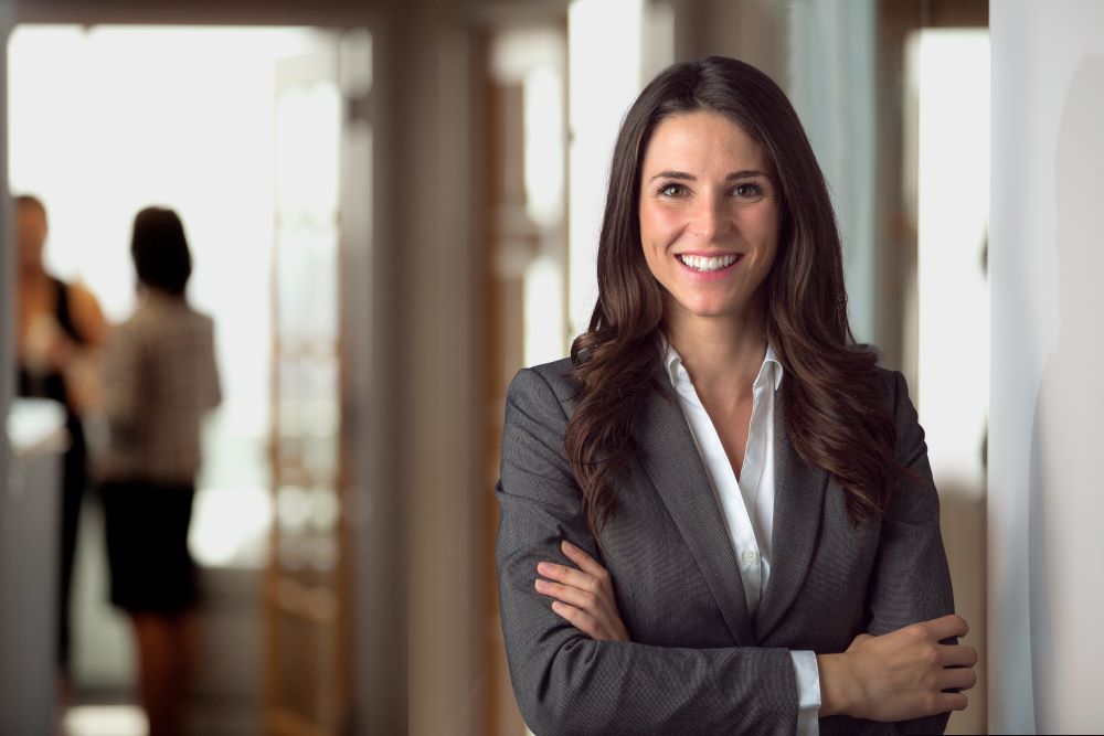 Self-Directed IRA Specialist smiling, dressed professionally to indicate that Madison Trust is here to answer your questions about self-directed investing.