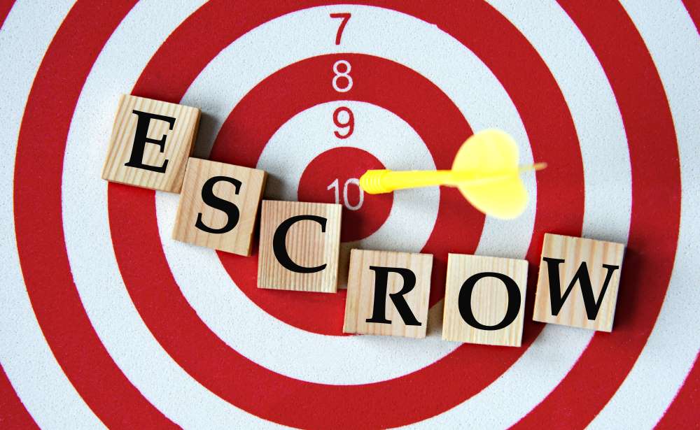 A target with the bullseye being ‘escrow’ depicting that the earnest money deposit should sit in an escrow account until the house is closed.