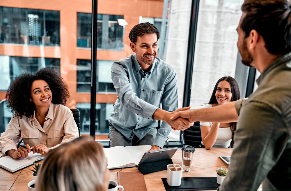 A group of investors peruse through their materials to determine their annual unrelated business income tax or UBIT tax rate.