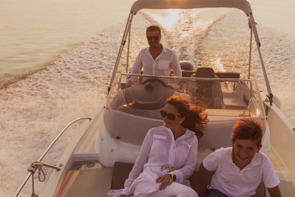A retired couple enjoy a casual rendezvous on a boat, delighted that they save so much annual income by evading unrelated business income tax (UBIT).